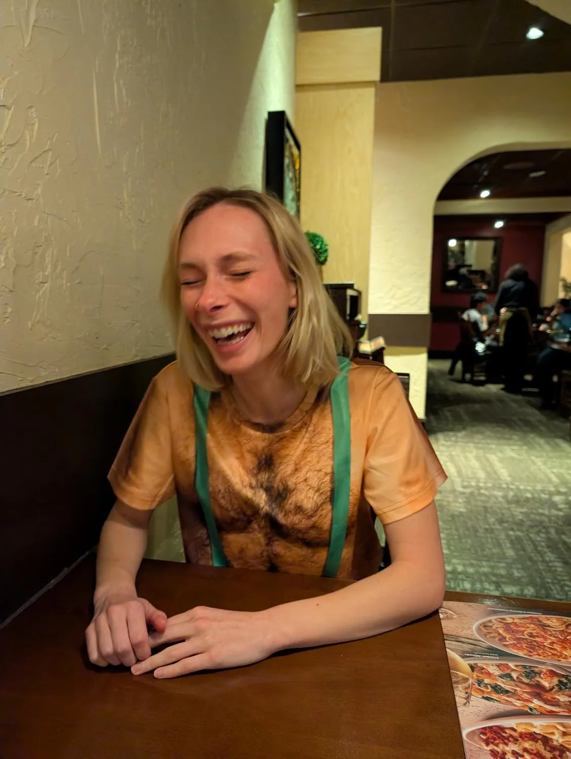 Ashley laughing, head tipped back.