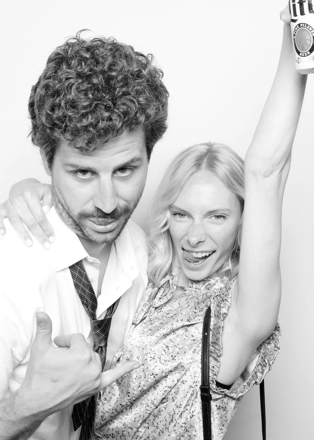 Four photo booth frames of Sean and Ashley pulling faces.